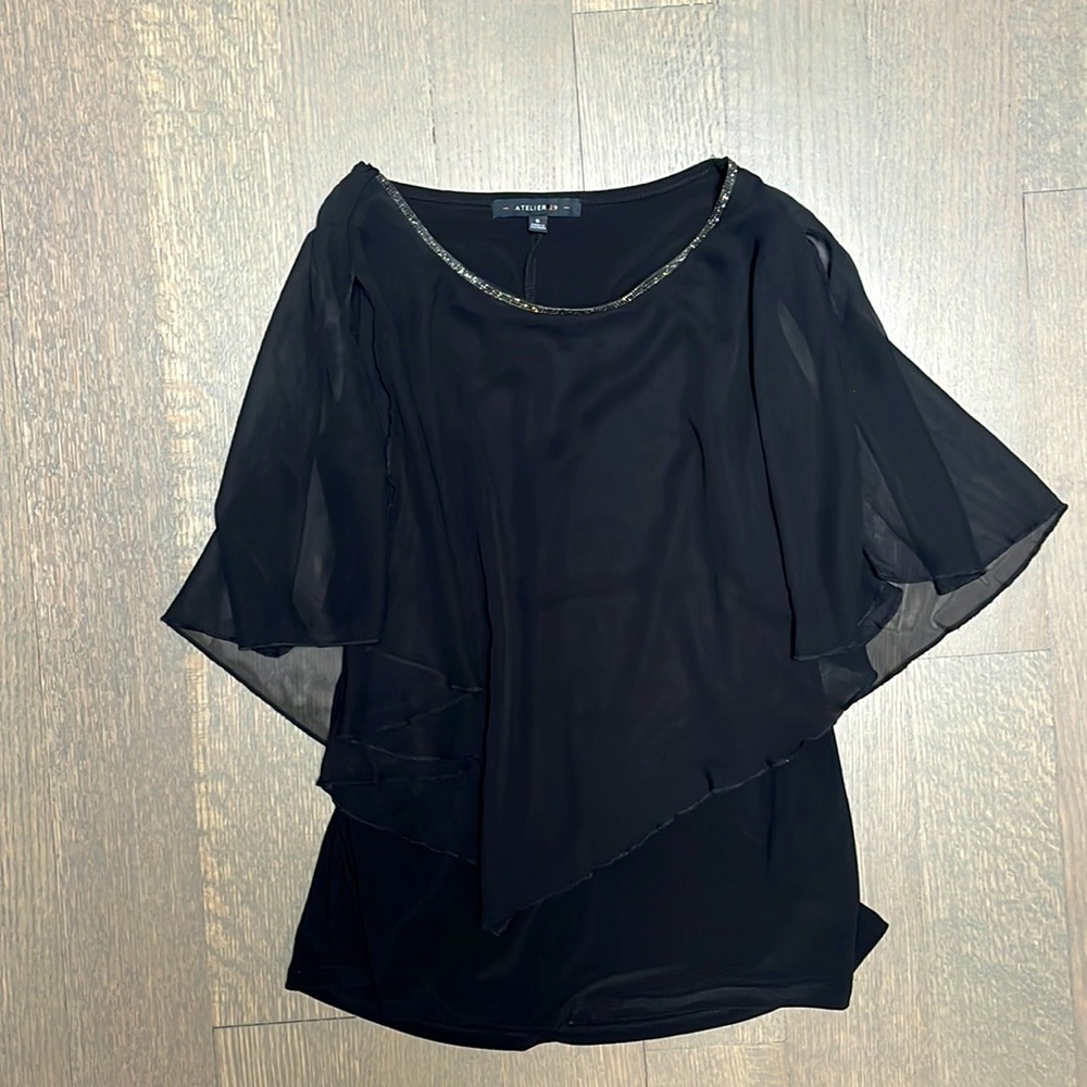 Sleeveless sheer top with bejewel colar